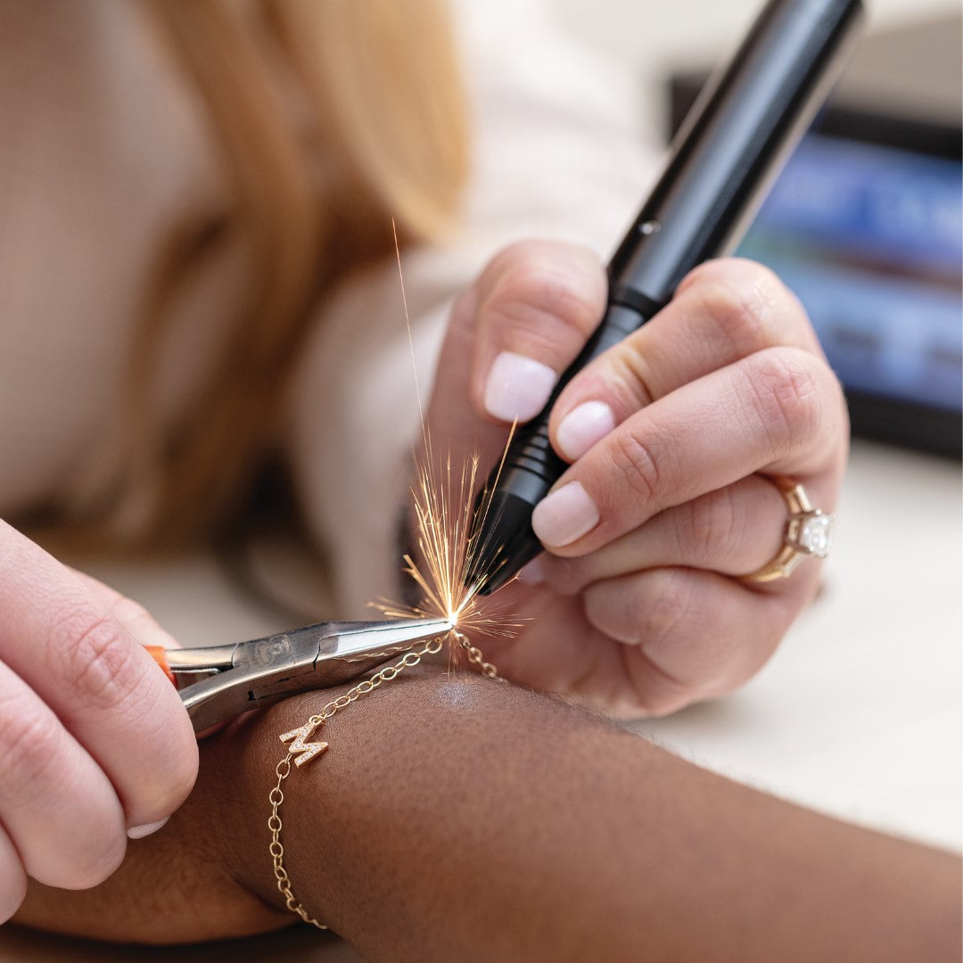 Custom bracelets made with precision. Learn more about Permanent Jewelry in our blog