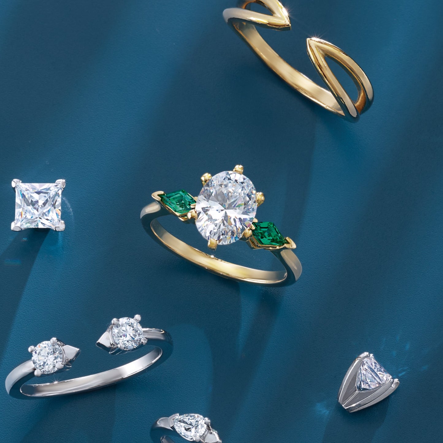 Custom 3-Stone Oval and Emerald Engagement Ring